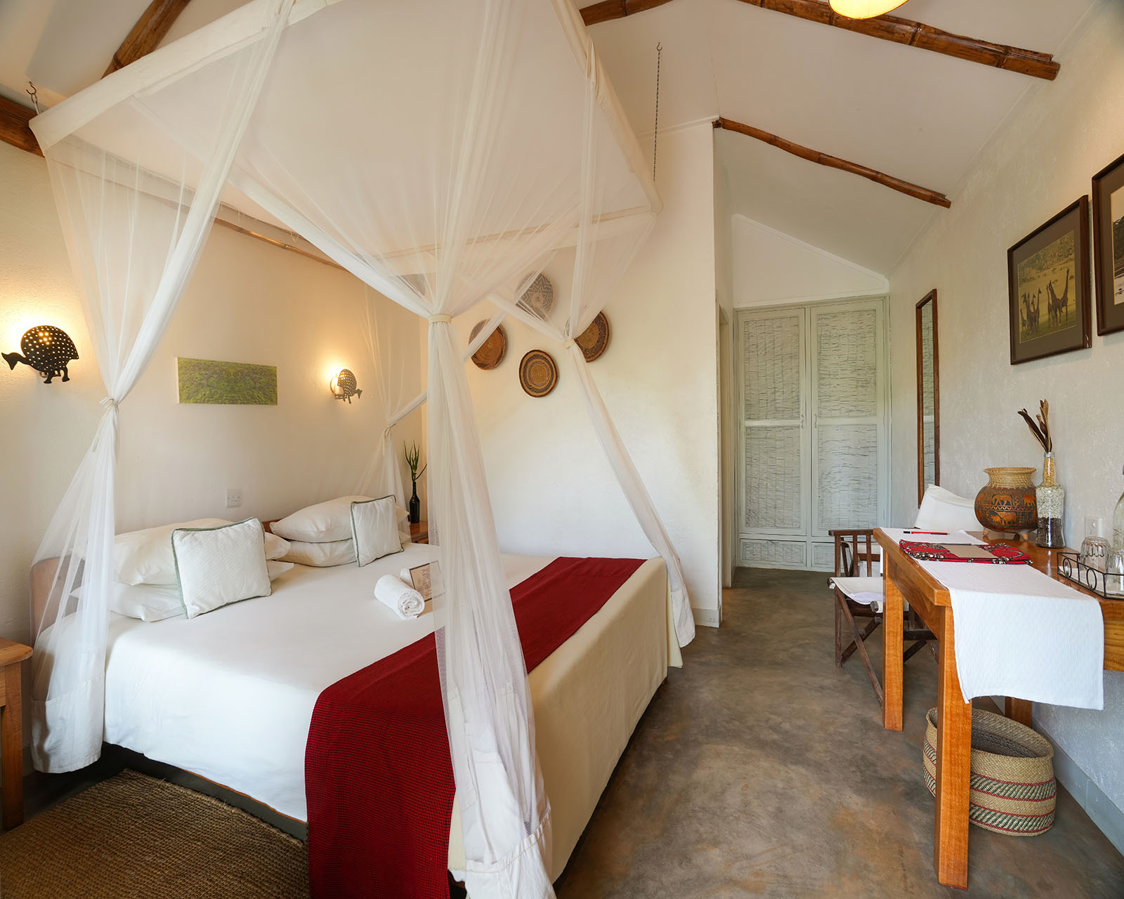 Ndutu Safari Lodge luxury bedroom with four-poster mosquito net